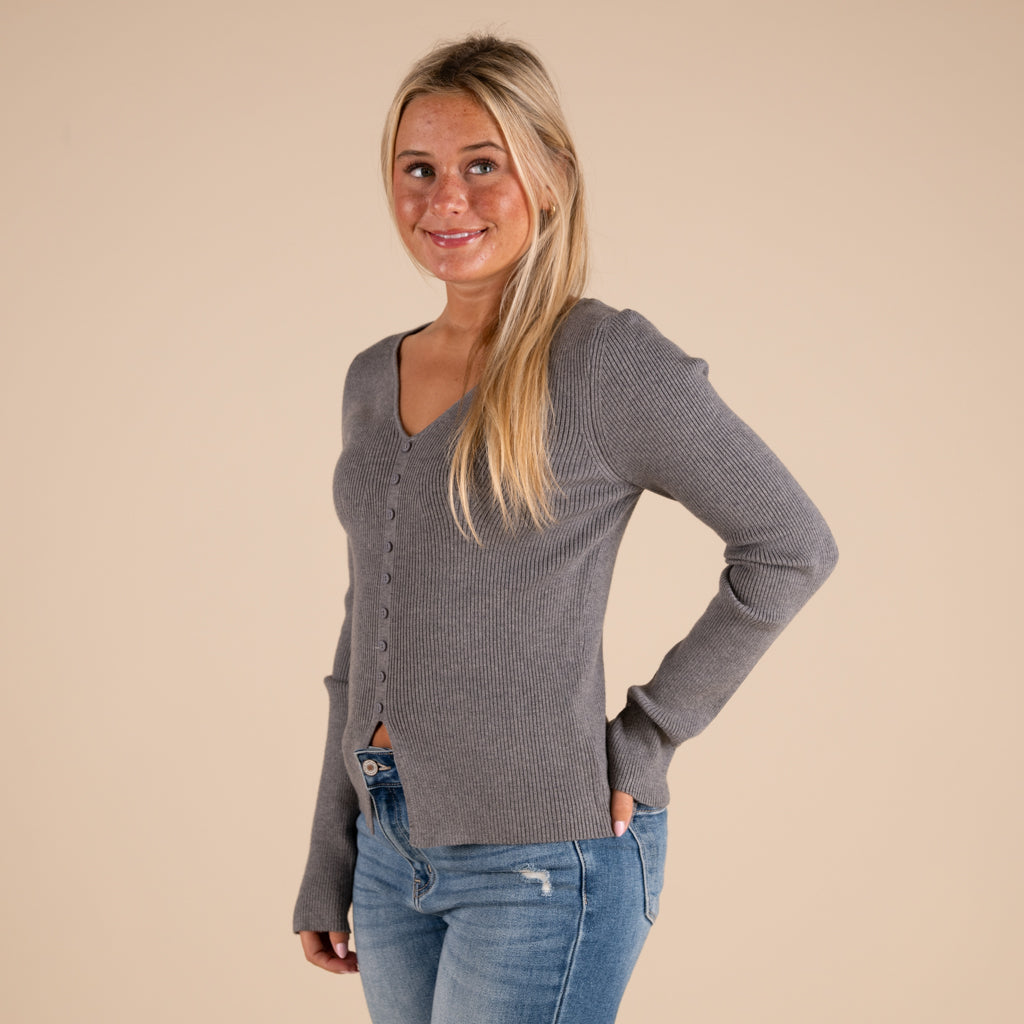 Very J Grey Ribbed V-neck Button Down Long Sleeve Sweater on model paired with medium wash denim jeans