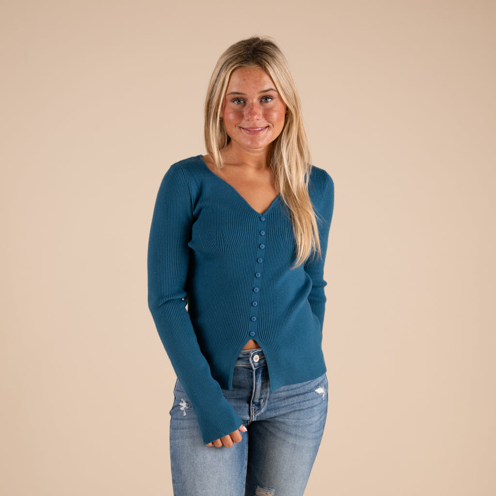 Very J Grey Ribbed V-neck Button Down Long Sleeve Sweater on model paired with medium wash denim jeans