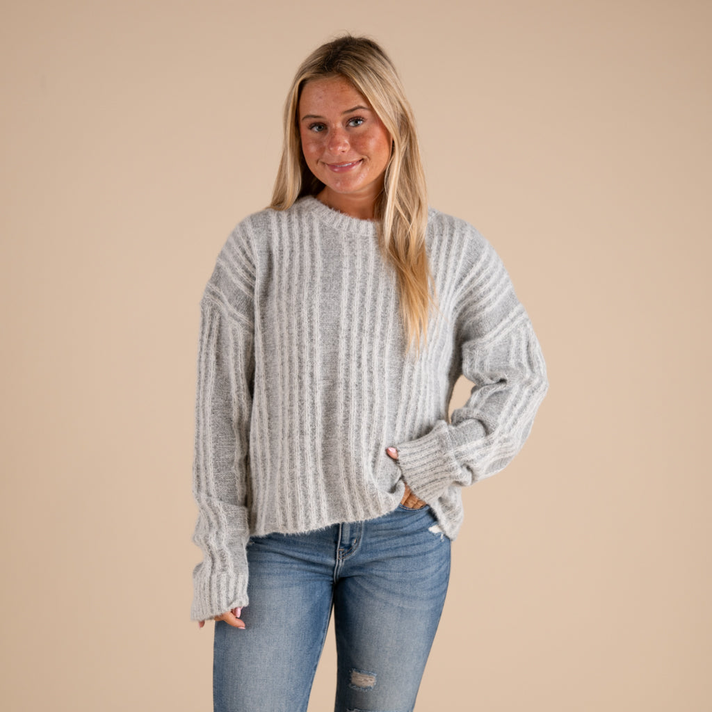 Very J Fuzzy Vertical Stripe Crewneck Sweater in grey shown on model paired with denim jeans