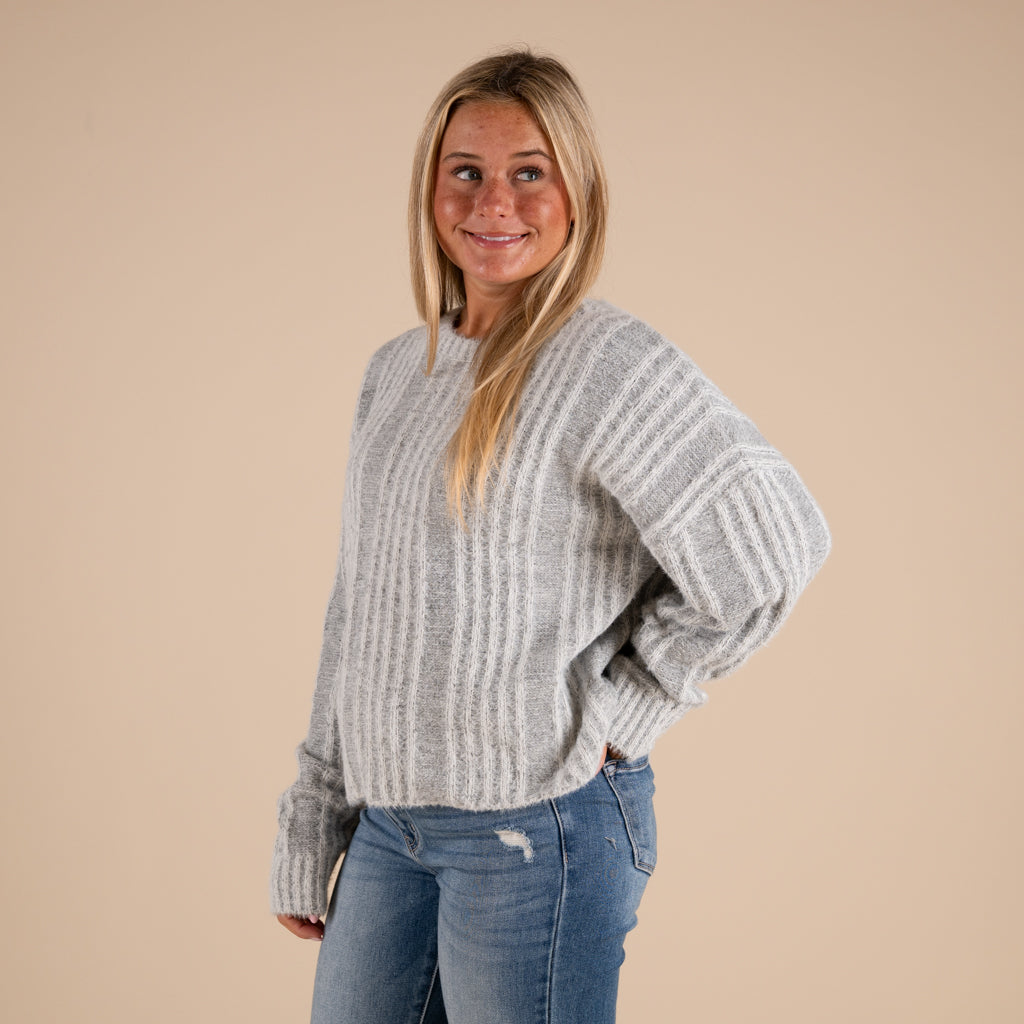 Very J Fuzzy Vertical Stripe Crewneck Sweater in grey shown on model paired with denim jeans