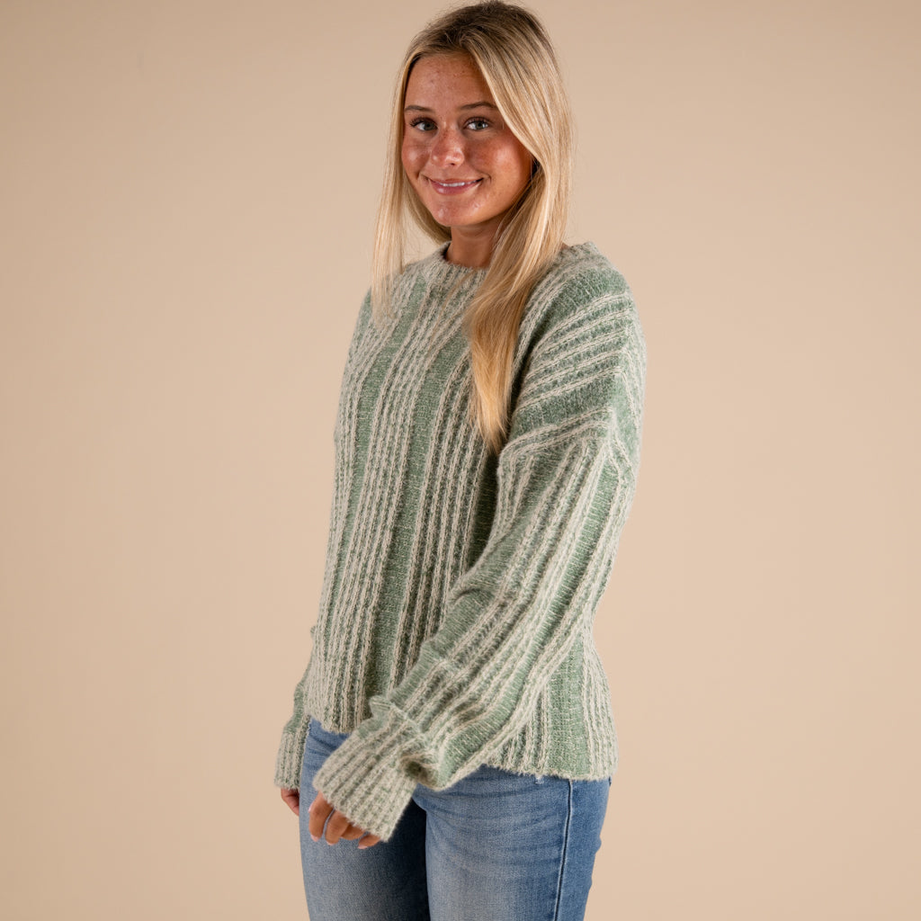 Very J Fuzzy Vertical Stripe Crewneck Sweater in sage shown on model paired with denim jeans