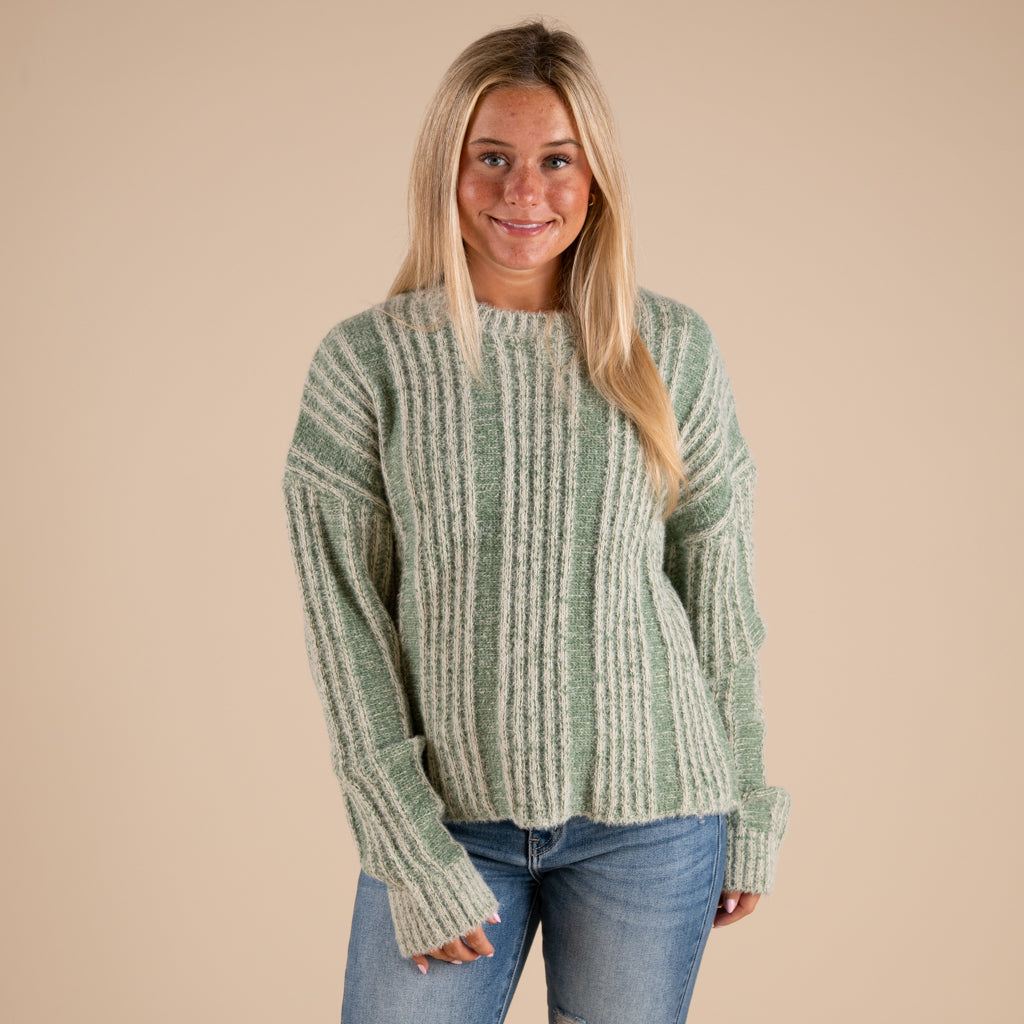 Very J Fuzzy Vertical Stripe Crewneck Sweater in sage shown on model paired with denim jeans