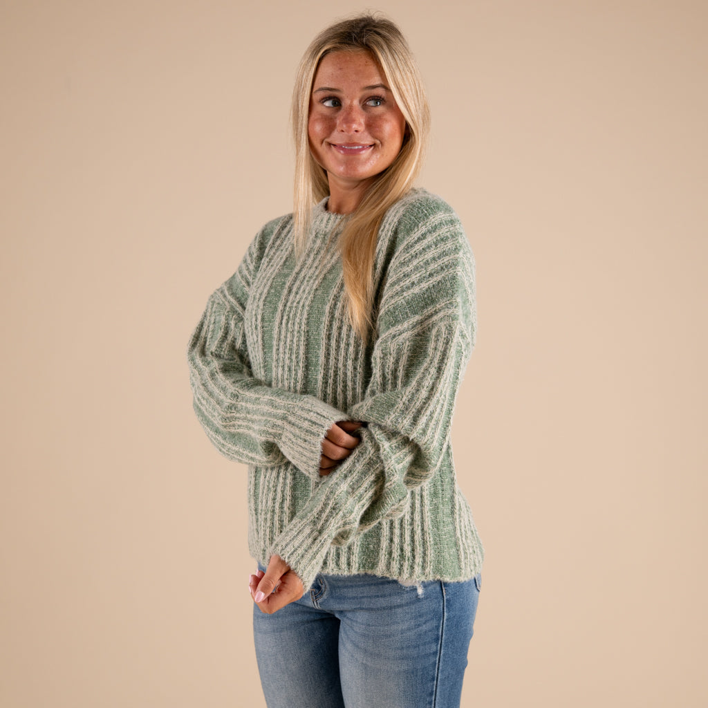 Very J Fuzzy Vertical Stripe Crewneck Sweater in sage shown on model paired with denim jeans