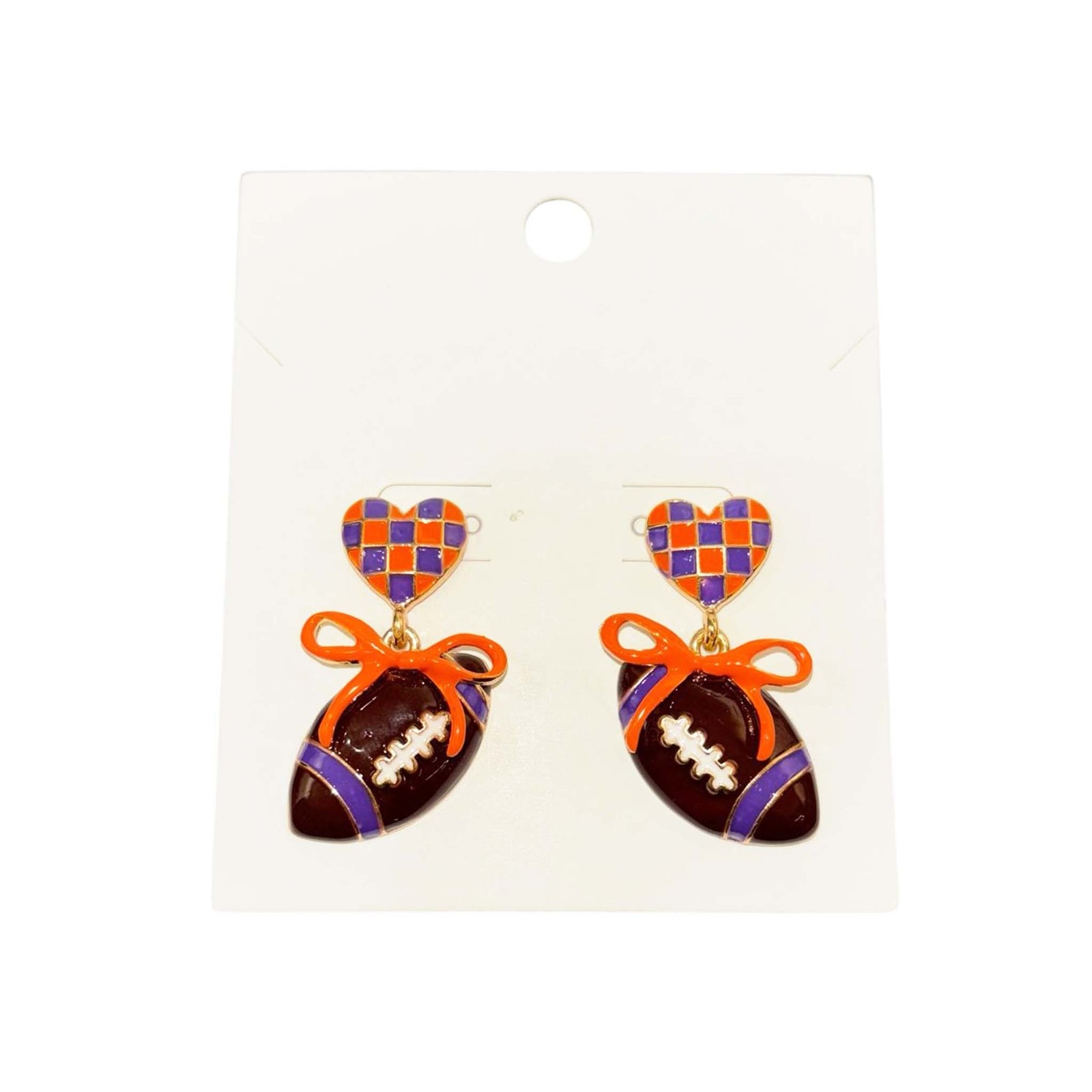 orange and purple checkered heart stud earrings featuring dangling football charms tied with orange bows.