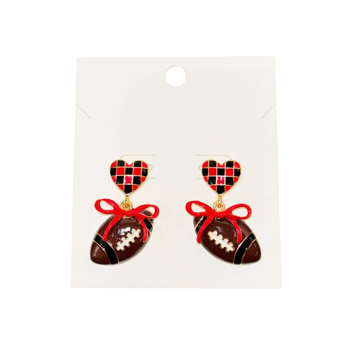red and black checkered heart stud earrings featuring dangling football charms tied with red bows.