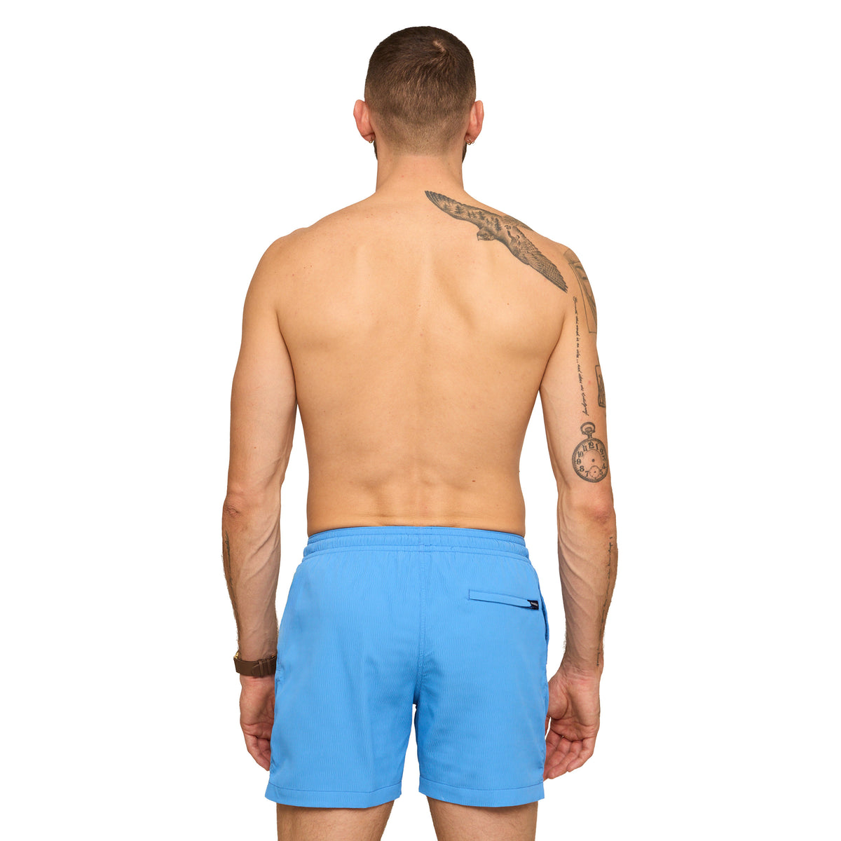Man wearing blue Chubbies swim shorts on a white background