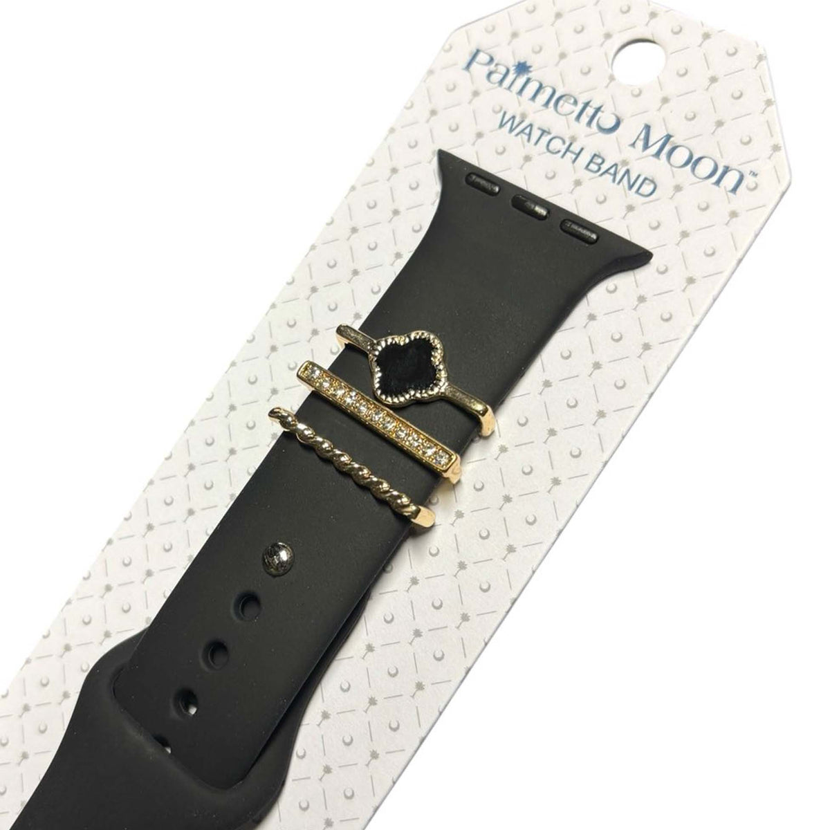 Black Palmetto Moon Apple Watch band with gold accent rings including a black clover, rhinestone bar, and rope twist design.