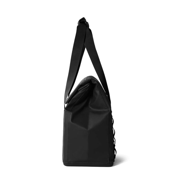 Side view of the YETI Daytrip 14L Tote Bag in Black with the shoulder strap extended upward.