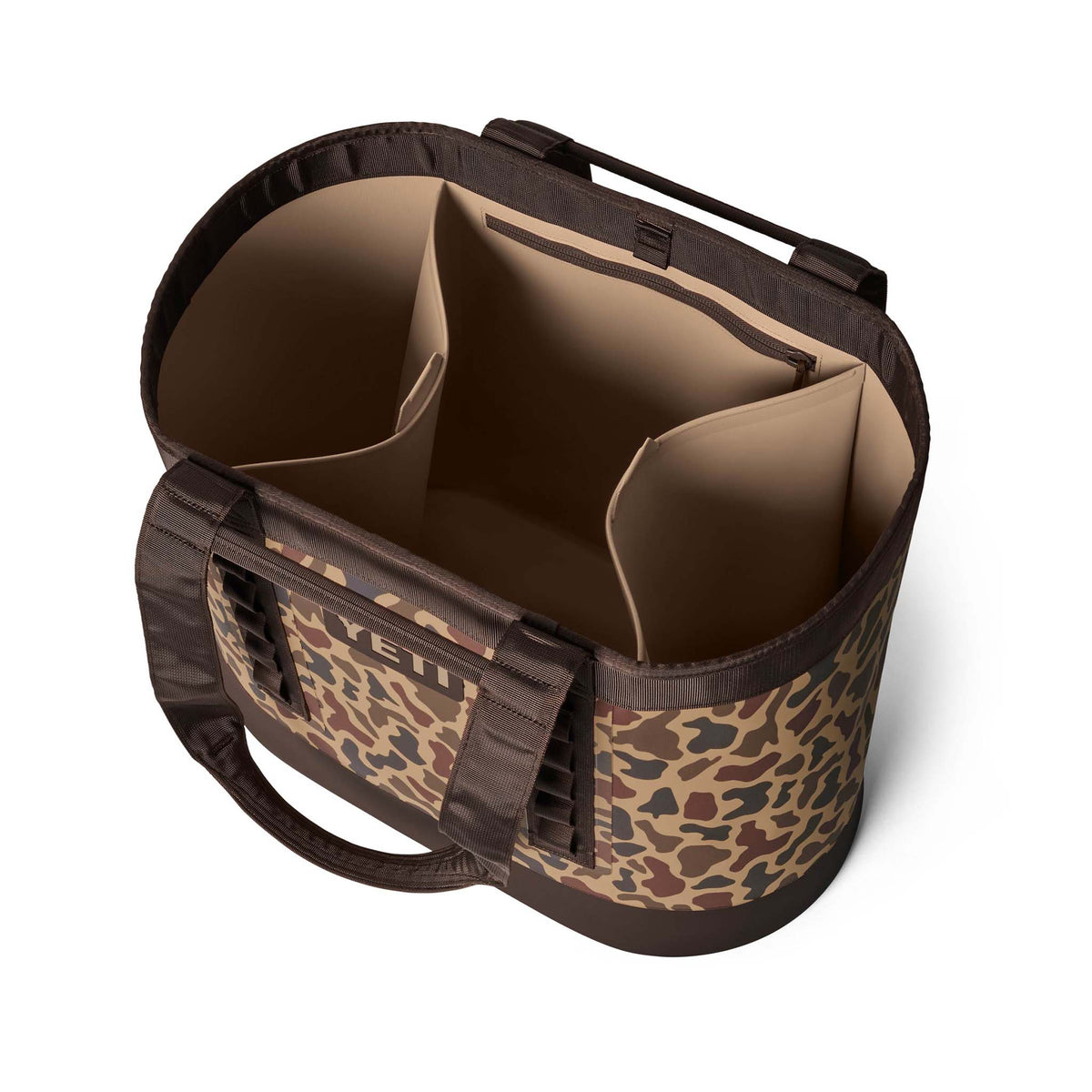 Angled detail of the YETI Camino 50 Carryall with side pocket and camouflage exterior.