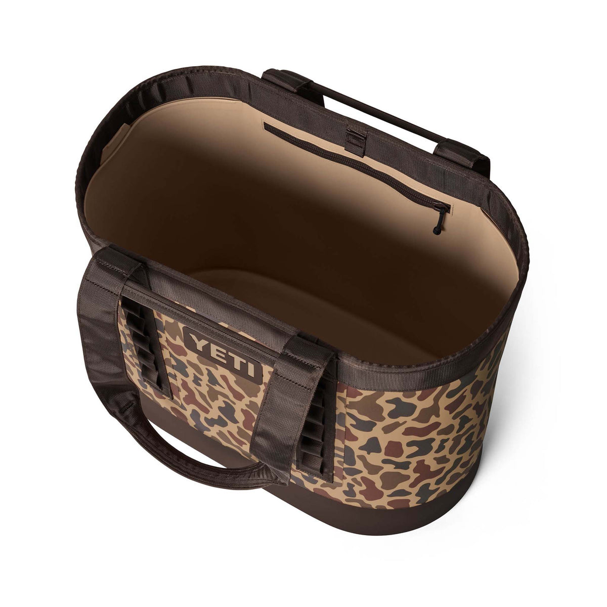 Side view of the YETI Camino 50 Carryall in Wetlands Camo showing rugged construction and reinforced handles.