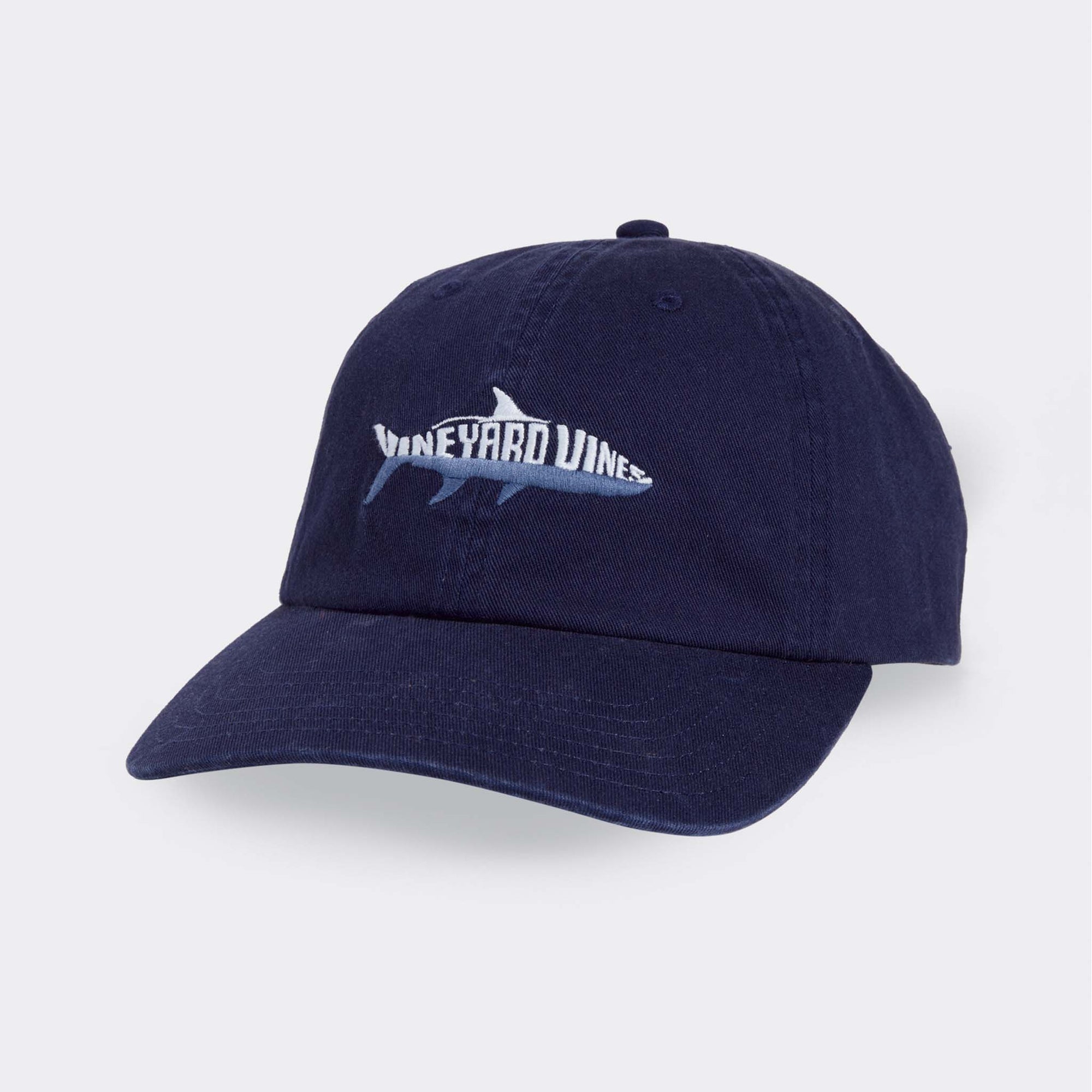 Navy blue cap with a shark logo and 'Wineyard Vines' text on a light gray background