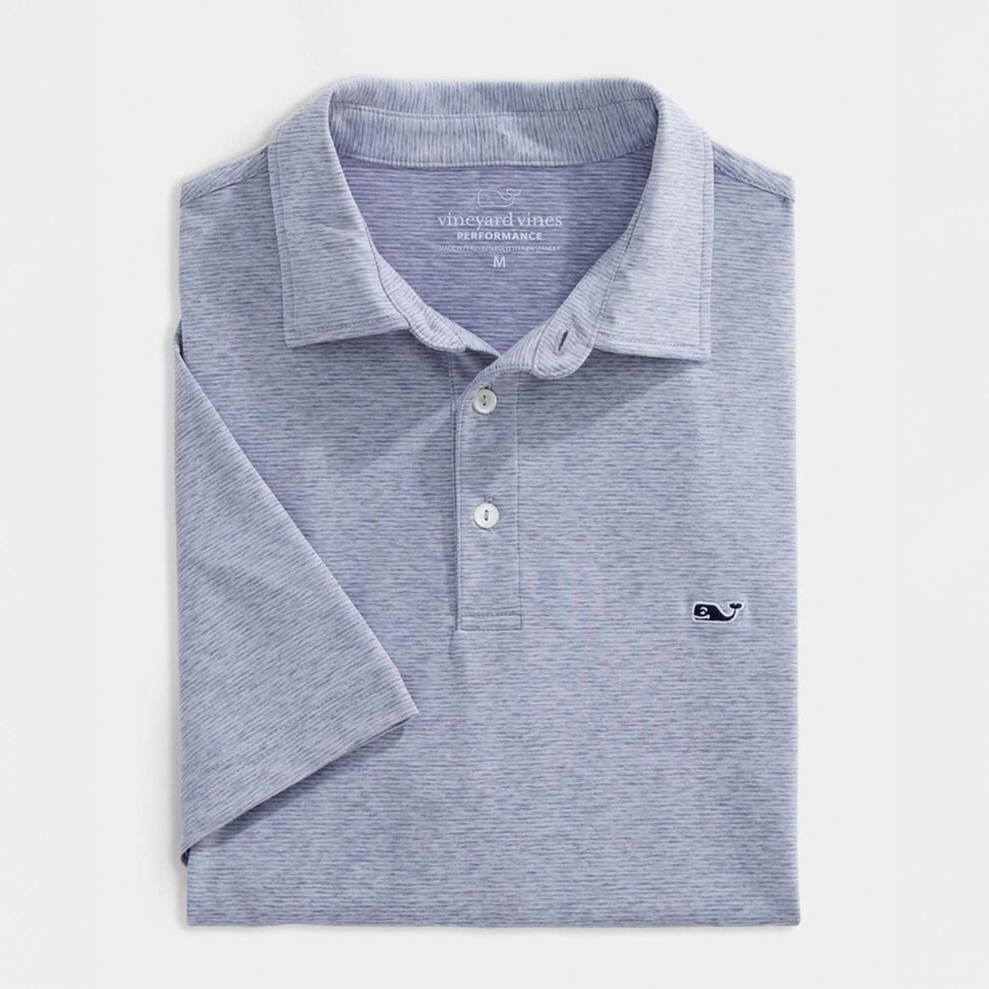 Vineyard Vines Men's Short Sleeve Polo in Hammerhead, sizes S-XXL. Folded polo shirt laid flat with three-button placket and embroidered whale logo on left chest. Color is a muted blue.