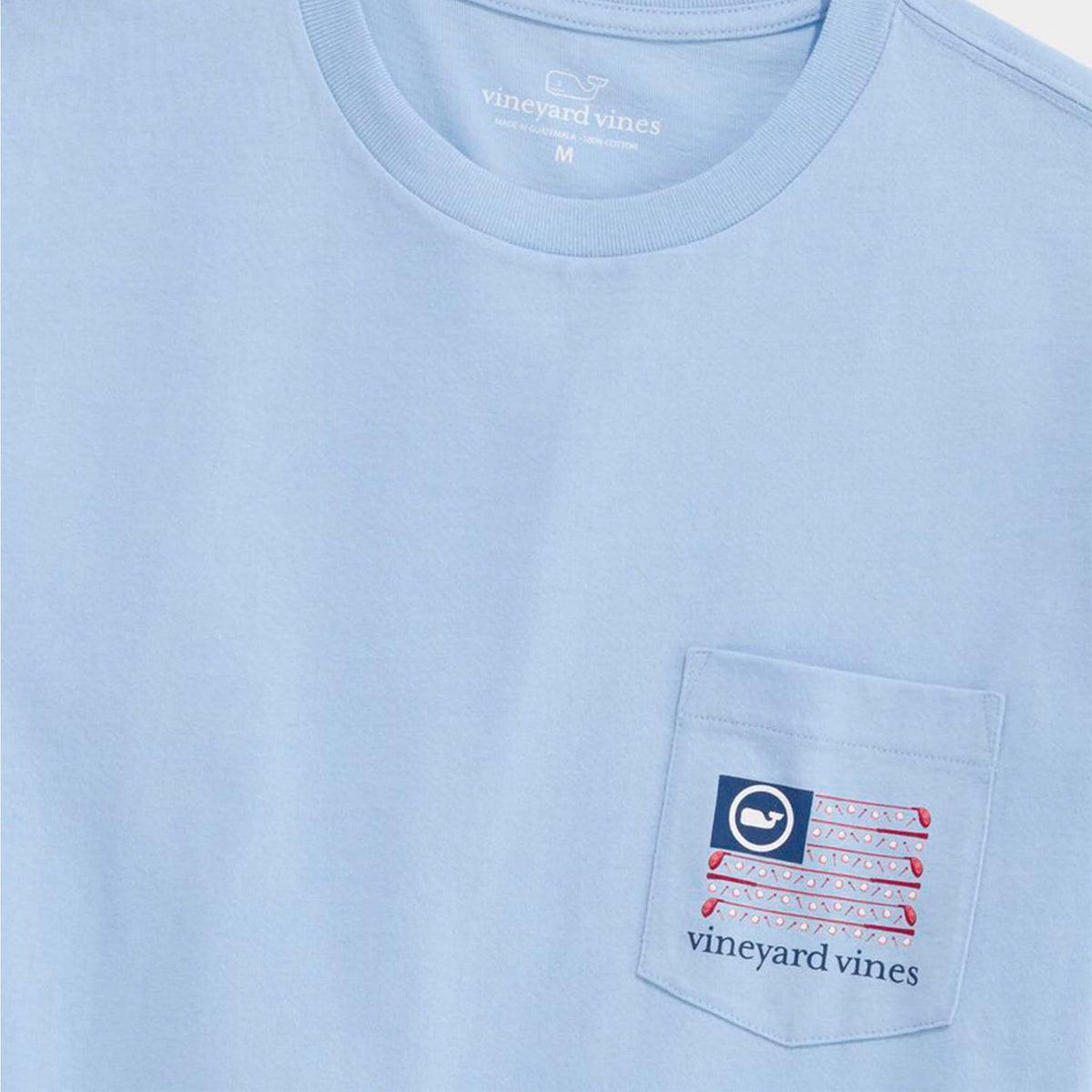 Light blue t-shirt with a pocket design and 'vineyard vines' branding.