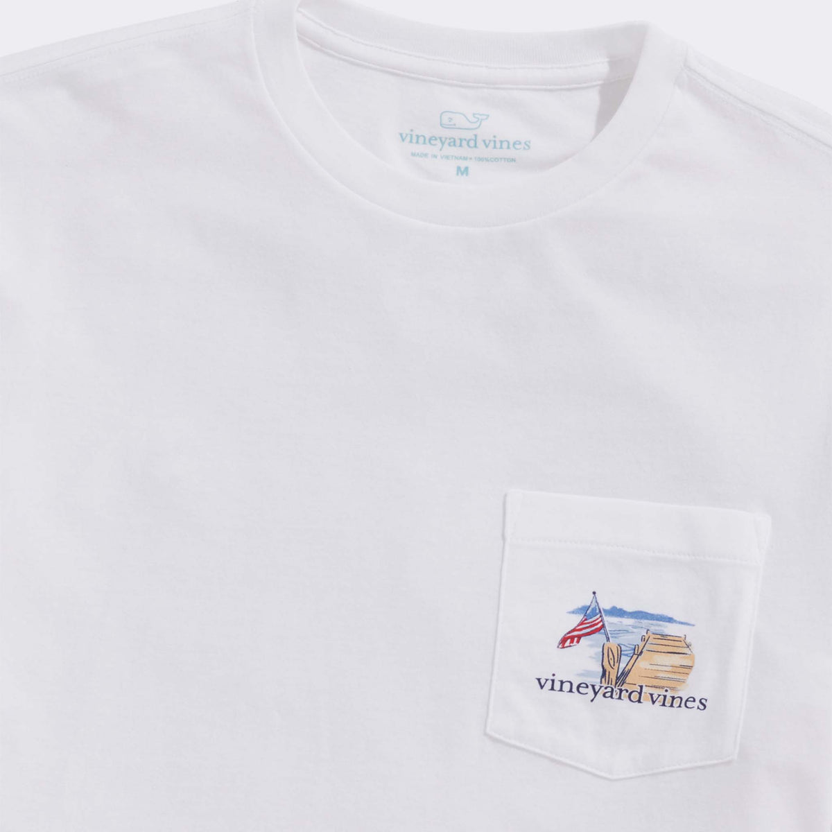 White t-shirt with a pocket featuring an embroidered design and 'vintage vines' branding.