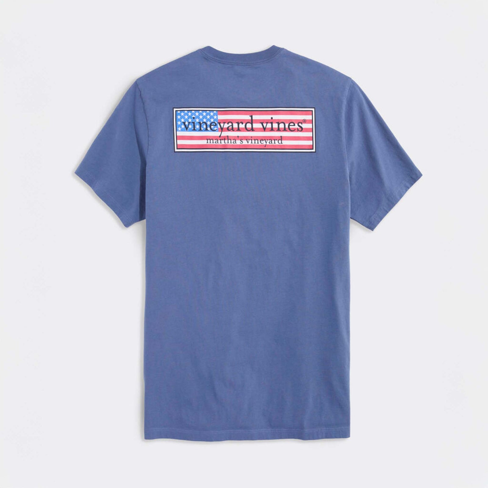 Vineyard Vines short sleeve t-shirt in blue, back features rectangular graphic with American flag and “vineyard vines martha’s vineyard” text.
