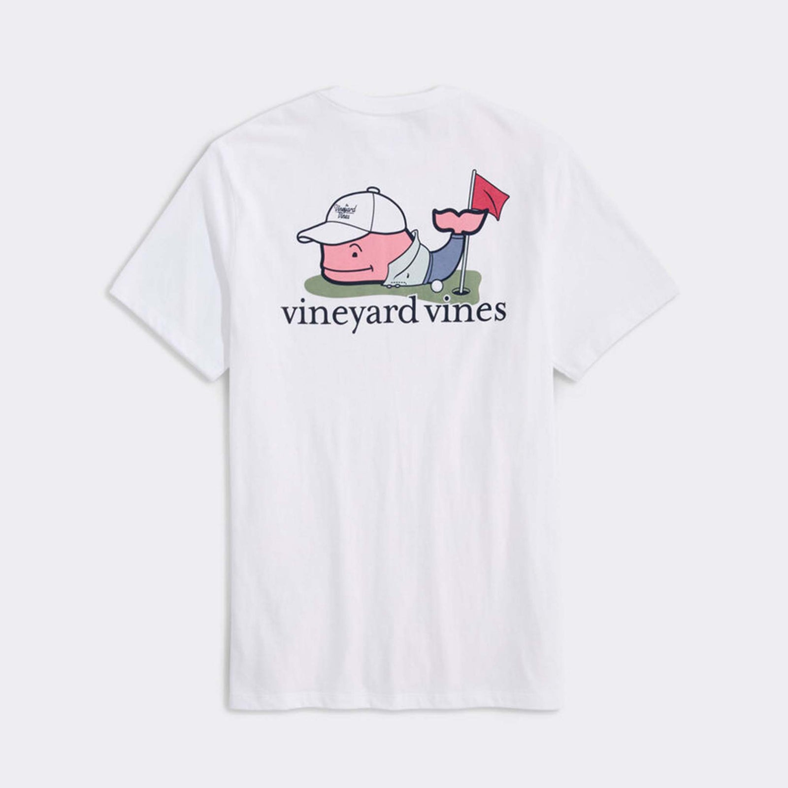 Back view of a white Vineyard Vines short-sleeve t-shirt. The back features a large graphic of the signature whale dressed for golf, complete with cap and polo, next to a golf hole with a red flag and ball. "vineyard vines" is printed underneath in black text.