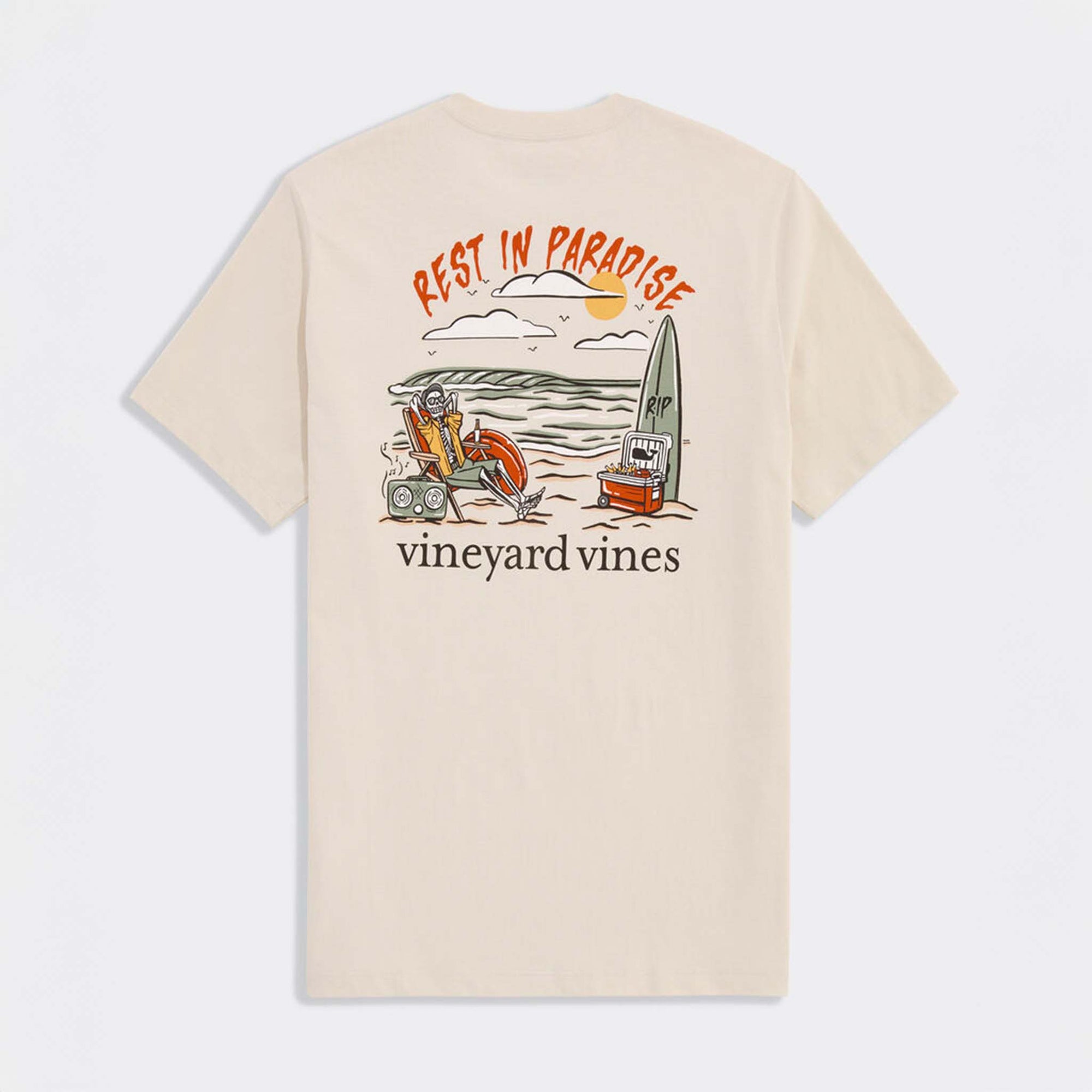 Back view of stone Vineyard Vines t-shirt with large “Rest in Paradise” beach graphic featuring skeleton lounging by the ocean.