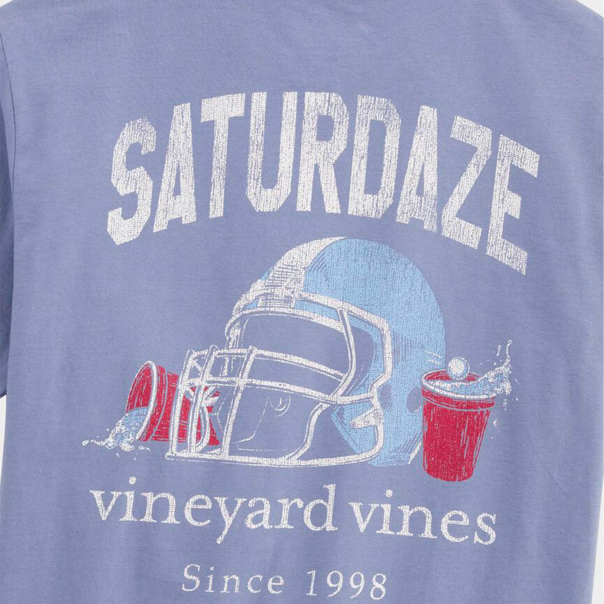 Blue t-shirt with 'Saturdaze' and 'vineyard vines' text and graphics on a blue background