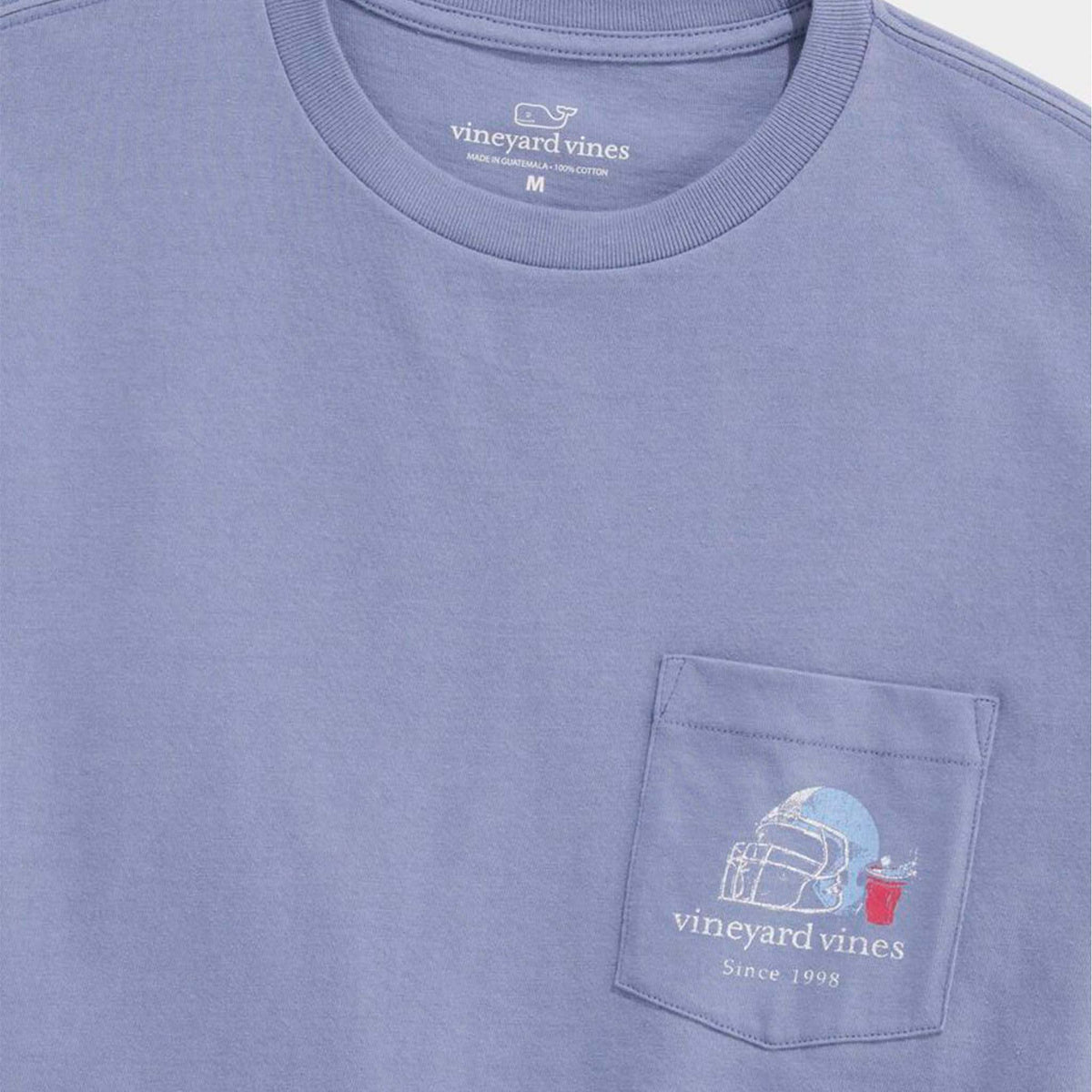 Blue t-shirt with Vineyard Vines logo and design on a plain background
