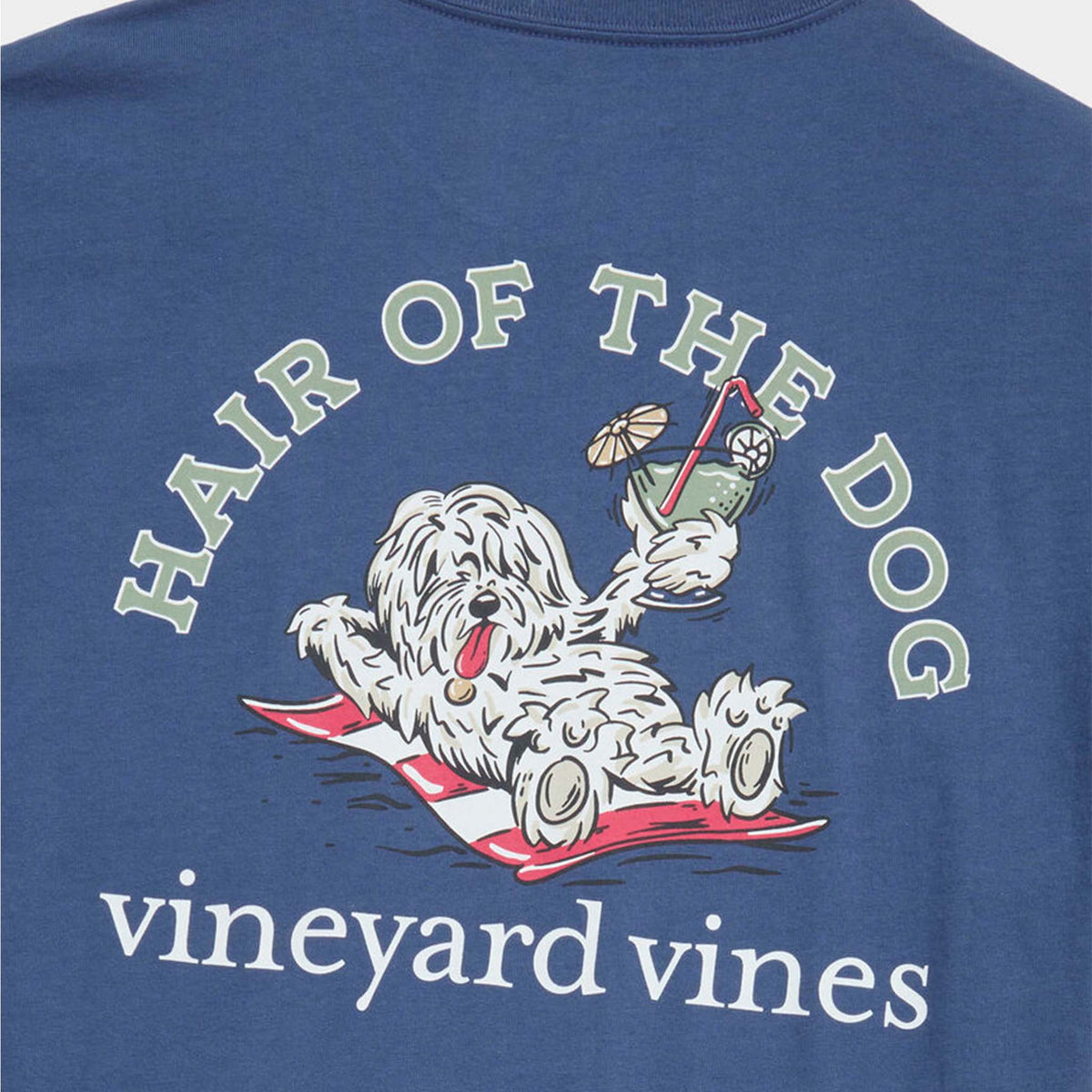 Close-up of back graphic with dog illustration, “Hair of the Dog” text above, and Vineyard Vines logo below.