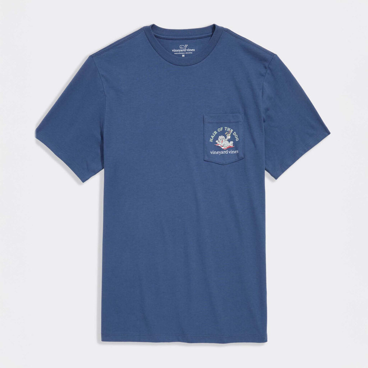 Front view of blue Vineyard Vines short sleeve pocket t-shirt with small “Hair of the Dog” graphic and logo on pocket.