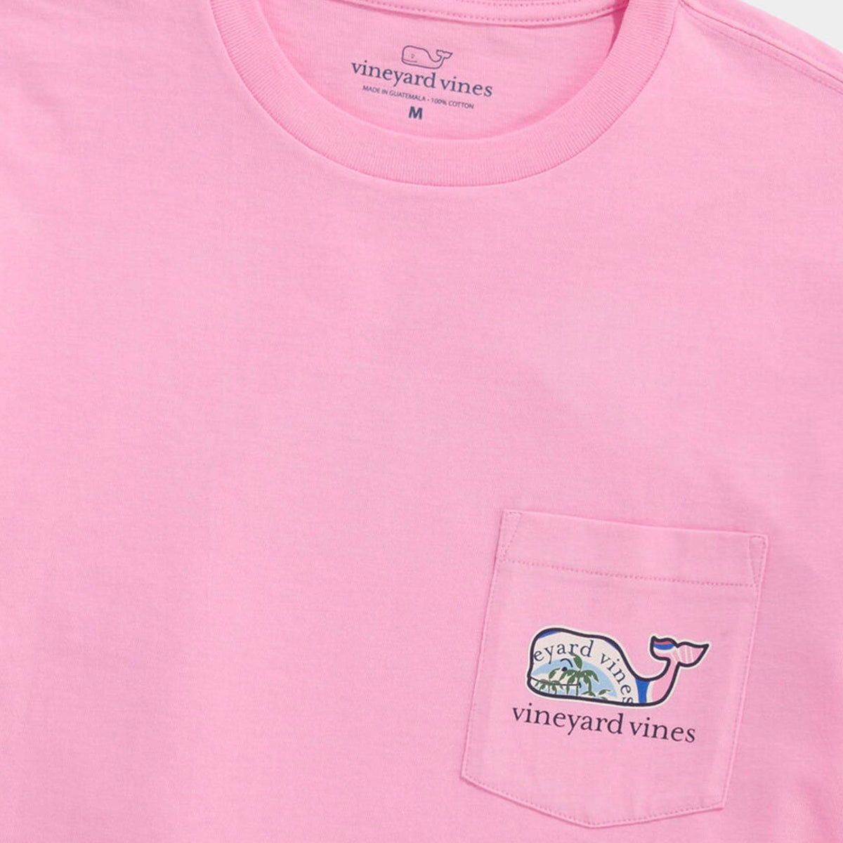 Pink Vineyard Vines pocket tee with small whale graphic on the chest pocket and “vineyard vines” text.