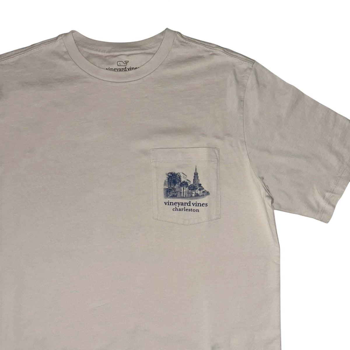 Beige t-shirt with a pocket design and 'vintage vines' branding on a white background