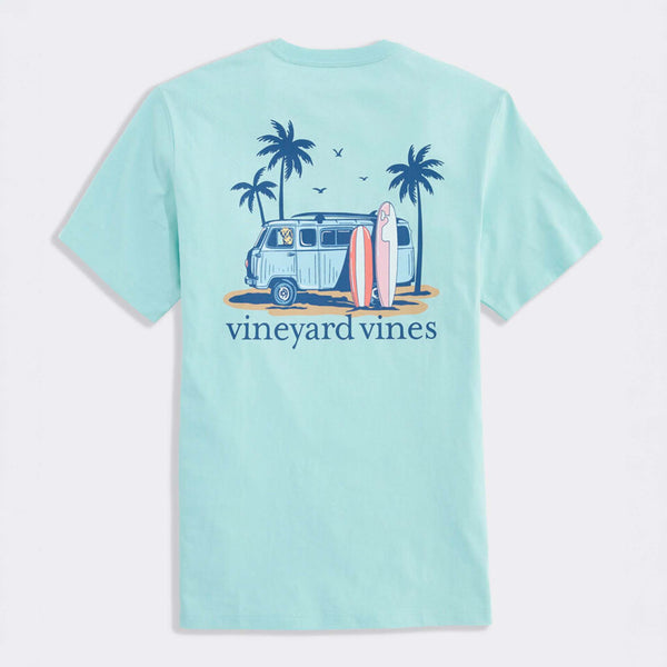 Light blue t-shirt with a graphic of a van, surfboards, and palm trees on the back, featuring the 'Vineyard Vines' brand.