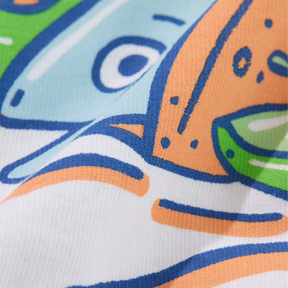 Close-up of a colorful fish design on fabric