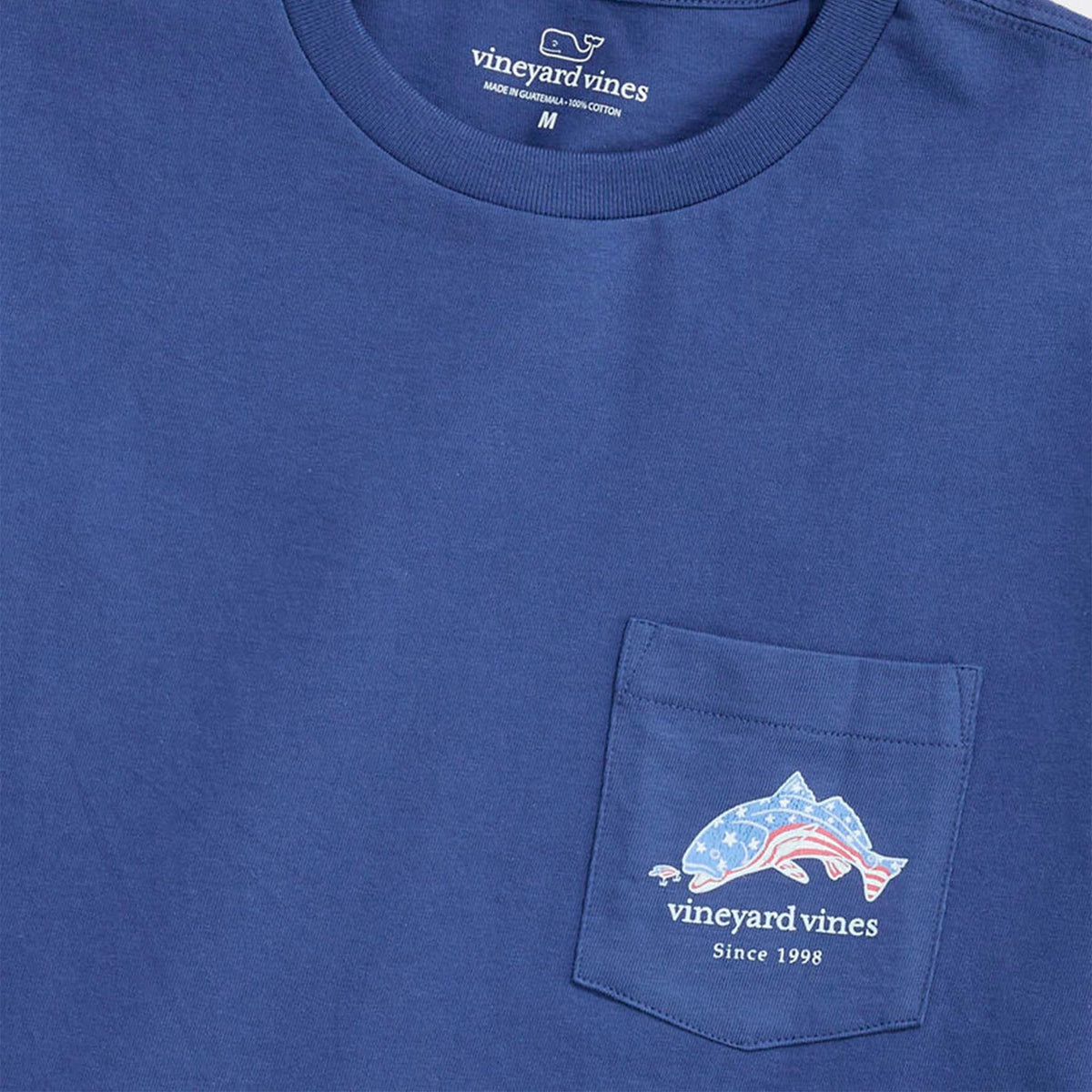 Blue t-shirt with an American flag filled fish graphic and 'Vineyard Vines' branding on a white background