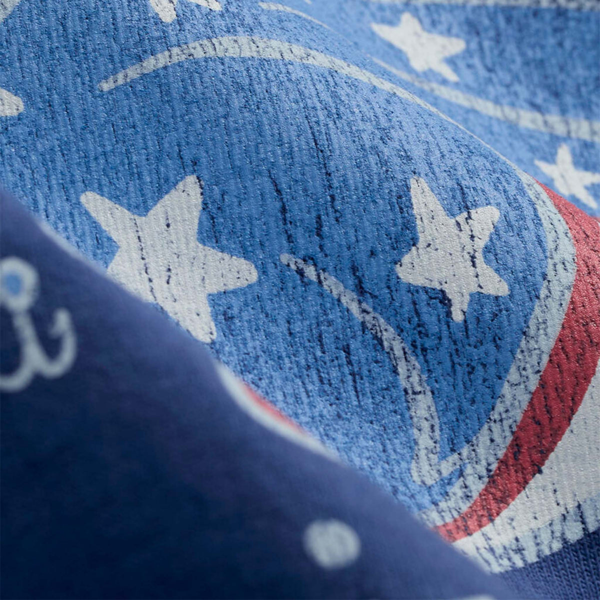 Blue t-shirt with an American flag filled fish graphic and 'Vineyard Vines' branding on a white background
