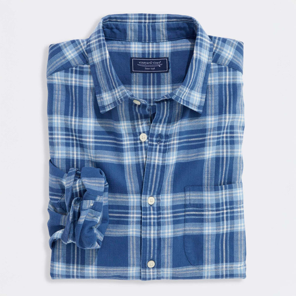 Folded Vineyard Vines blue plaid button-down shirt with front pocket and buttons visible.