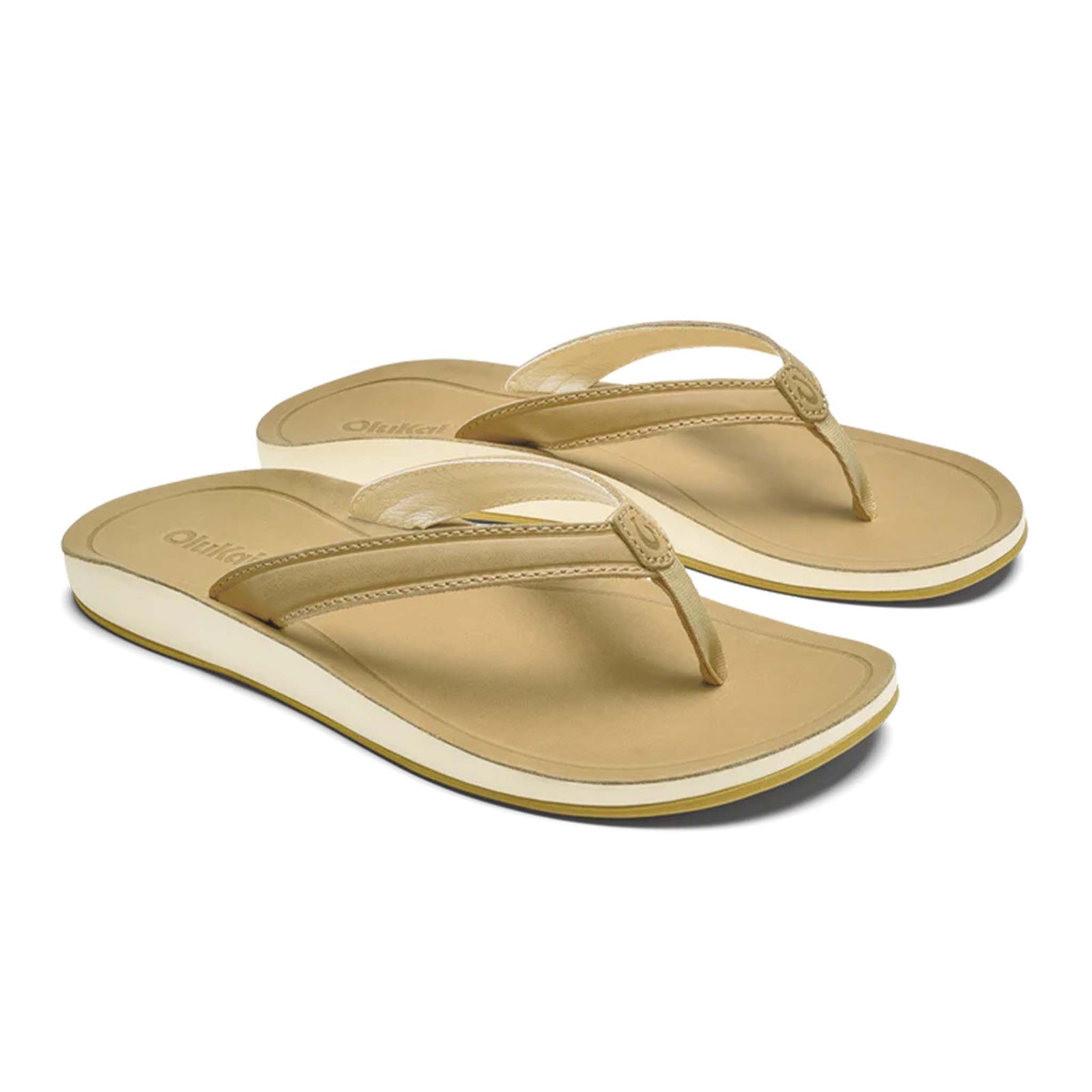 Olukai Women's Southshore Sandals in color Toasted Coconut, which is a light tan, sizes 6, 7, 8, 9, and 10.
Angled view of a pair of Olukai Southshore Sandals in Toasted Coconut, showing their rich brown leather straps and contoured footbeds with a clean and minimal silhouette.