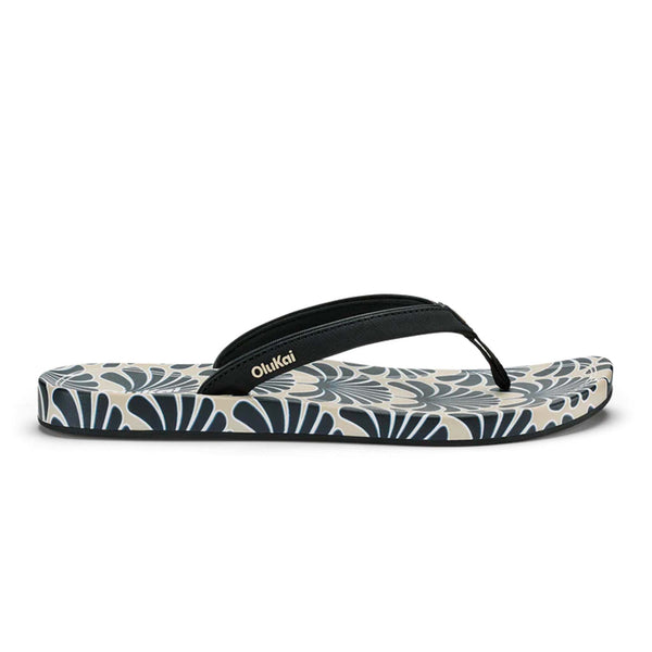 Black and beige floral Olukai sandal shown on a white background.