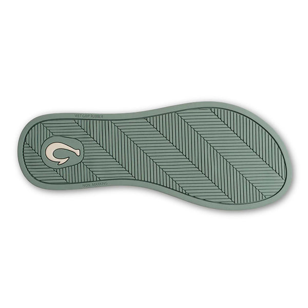Green shoe sole with a zigzag pattern on a white background