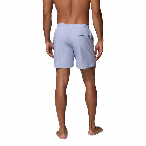  Man wearing light blue swim shorts on a white background