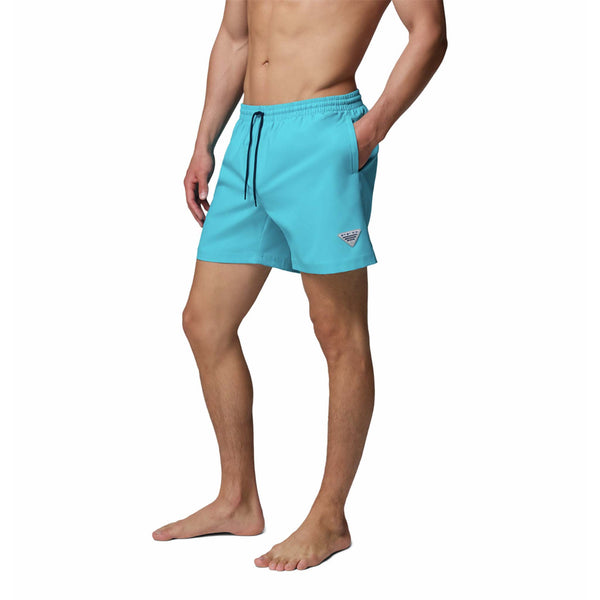  Man wearing turquoise swim shorts on a white background