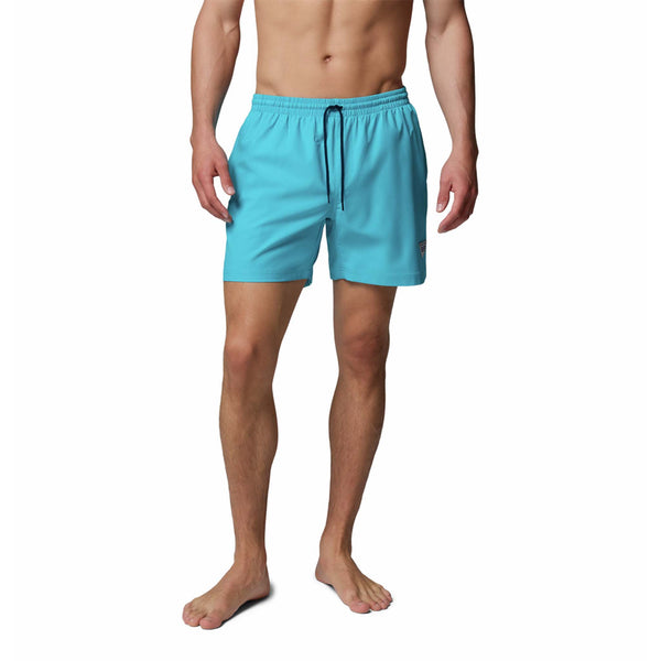  Man wearing turquoise shorts on a white background