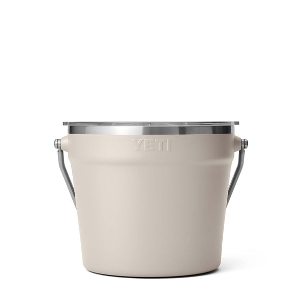 YETI branded beige bucket with silver handle on a white background