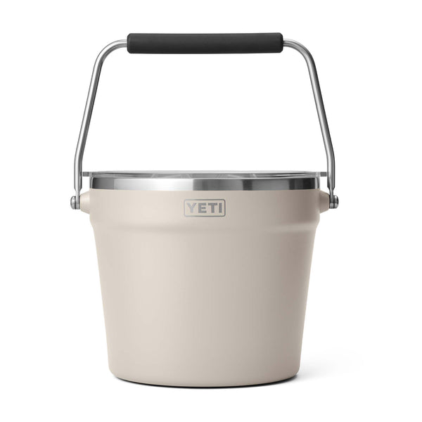 Beige YETI bucket with a black handle on a white background