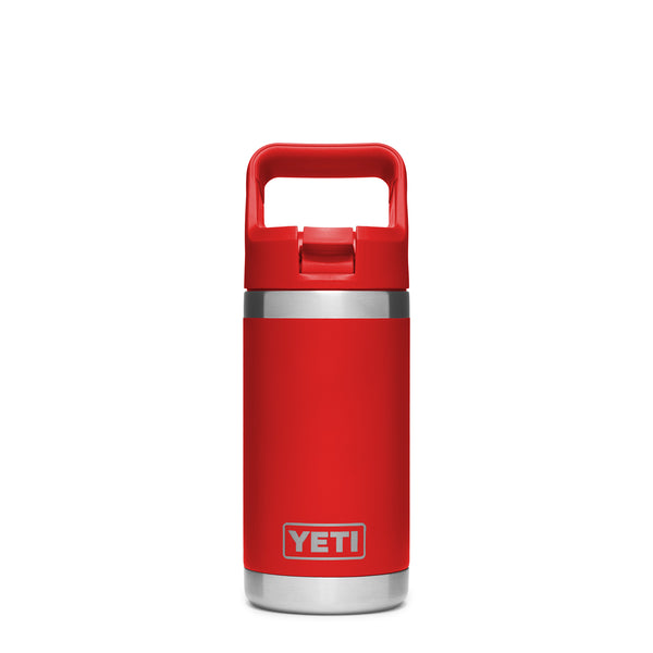 Rescue Red 12-ounce YETI Rambler Jr. Kids Bottle made from durable stainless steel, featuring double-wall vacuum insulation, a leak-resistant straw cap, and a sturdy carrying handle; includes the YETI logo on the front and a wide-mouth opening for easy cleaning.