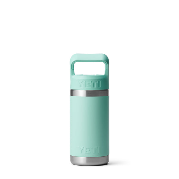 Seafoam green 12-ounce YETI Rambler Jr. Kids Bottle made of durable stainless steel with double-wall vacuum insulation, a leak-resistant straw cap, and a sturdy carrying handle; features the YETI logo on the front and a wide-mouth opening for easy cleaning.