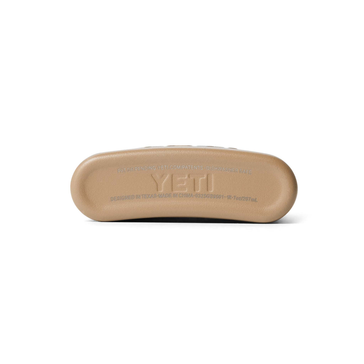 Bottom view of the YETI flask in tan with molded YETI branding and product text in raised letters.