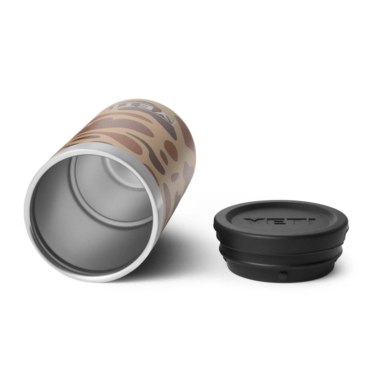 Interior view of YETI canister in Wetlands Camo laid on its side with lid placed beside it.