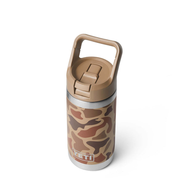 Angled top-down view of the bottle with straw cap closed and carrying handle upright.