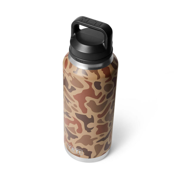 Angled view of YETI Rambler 36oz Bottle in Wetlands Camo showing the full shape and attached cap.