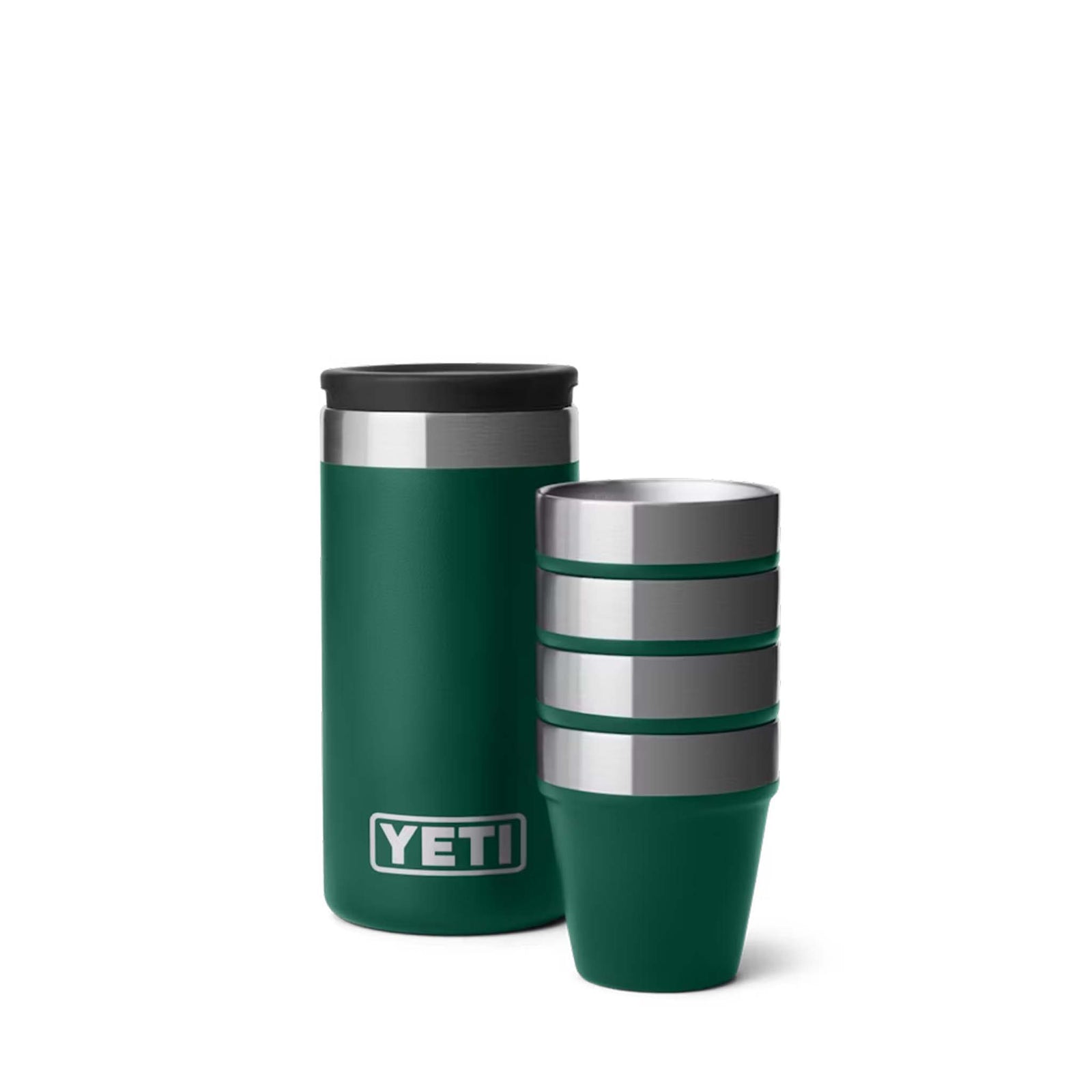 Stack of four YETI 1.5oz Stackable Shot Glasses in Black Forest Green with stainless steel rims, neatly nested together.
