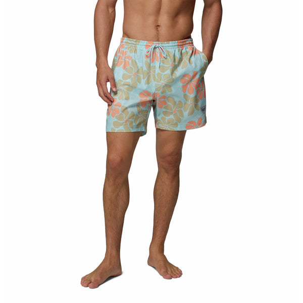  Man wearing colorful floral swim shorts on a white background
