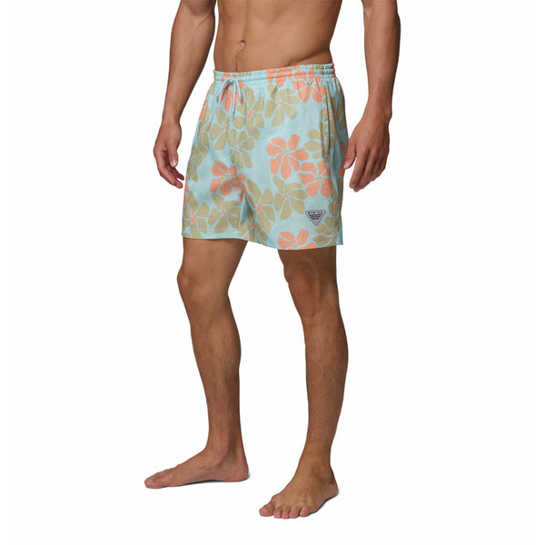  Man wearing a floral patterned swimsuit on a white background