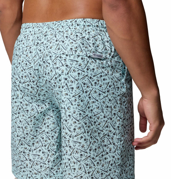  Patterned swim shorts worn by a person on a white background
